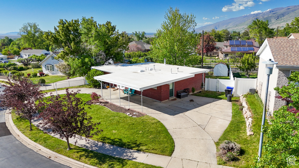 Aerial perspective of suburban area with a mountainous background