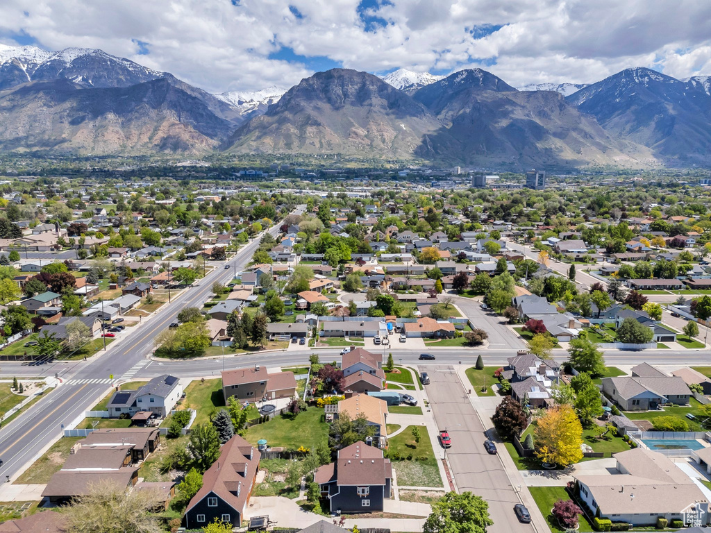 Aerial perspective of suburban area with a mountainous background