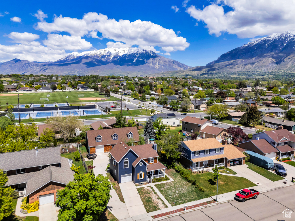 Aerial view of residential area featuring mountains