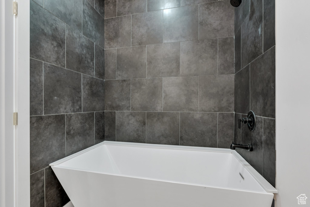 Full bathroom with a tub to relax in and a shower