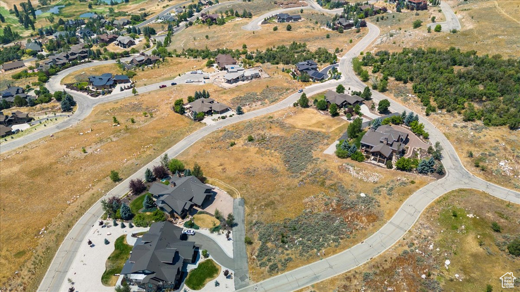 View of property location with nearby suburban area
