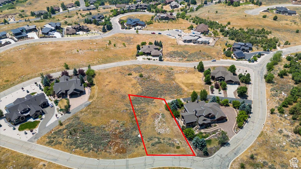 Aerial perspective of suburban area featuring property parcel outlined