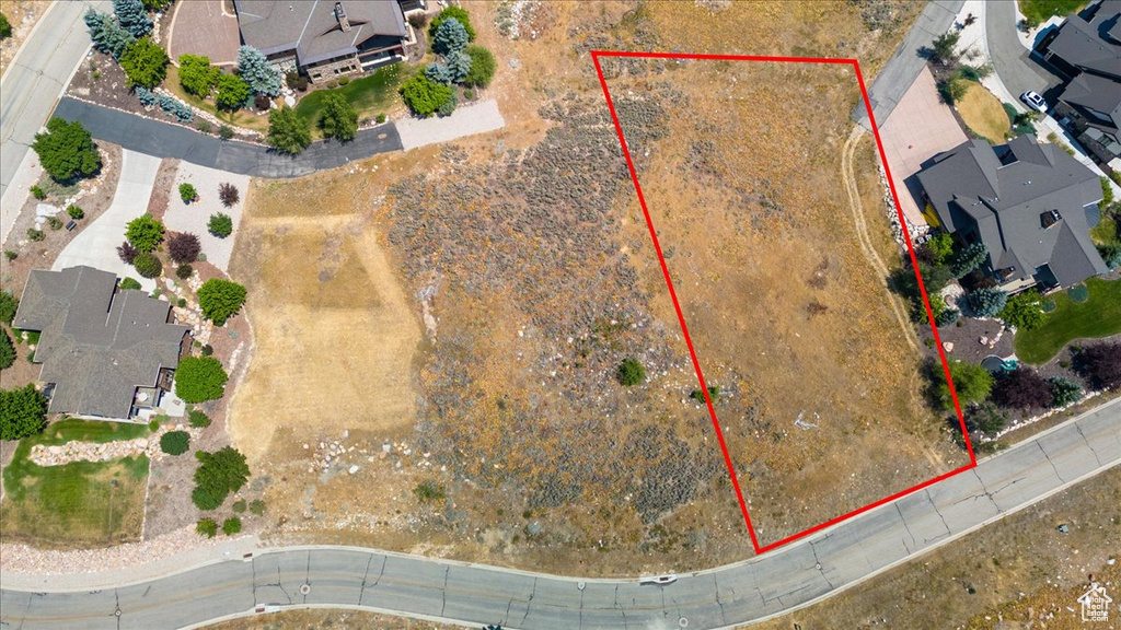 Aerial view of residential area with property parcel outlined