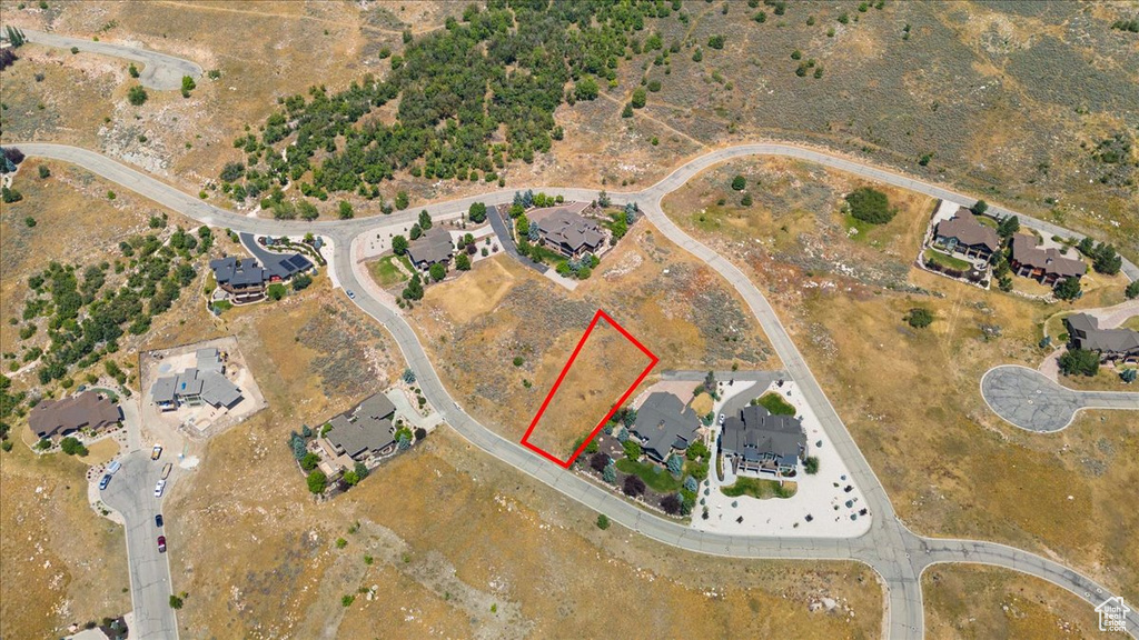 Aerial overview of property's location featuring property boundaries highlighted and nearby suburban area