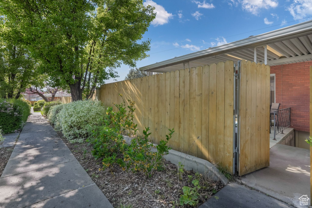 View of yard featuring fence