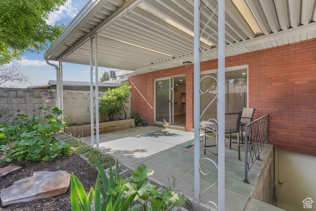 View of patio / terrace featuring fence
