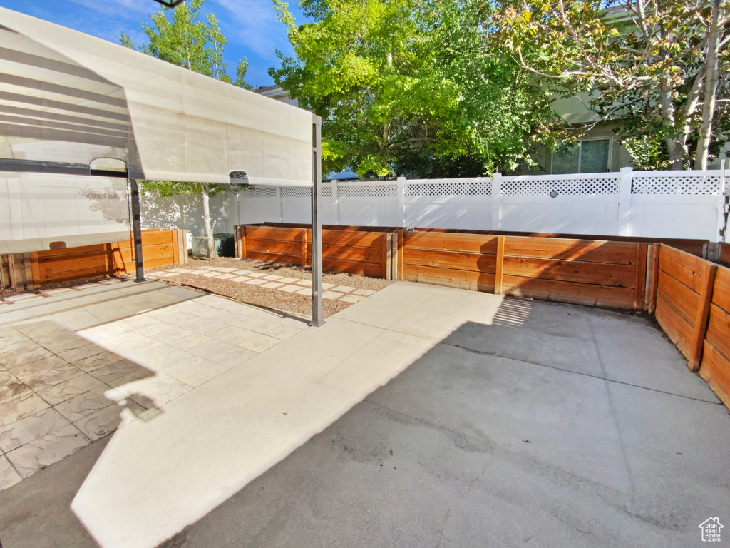 View of patio with a fenced backyard
