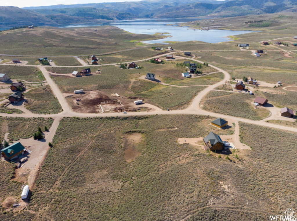 View of property location with a water and mountain view