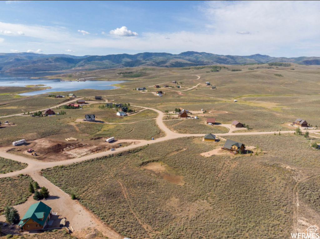 Aerial view of property's location with a water and mountain view and rural landscape