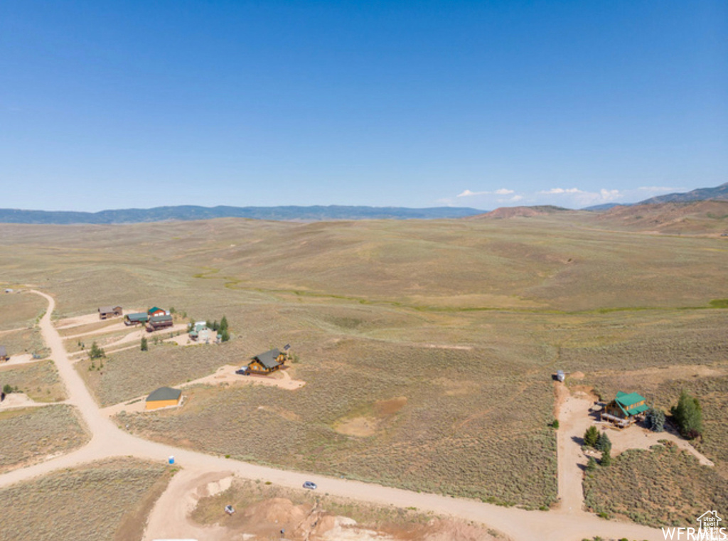 View of property location with a mountain backdrop and rural landscape