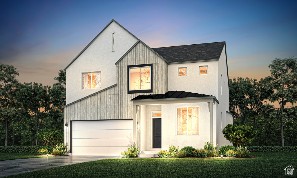 Modern farmhouse with a standing seam roof, concrete driveway, an attached garage, and a lawn