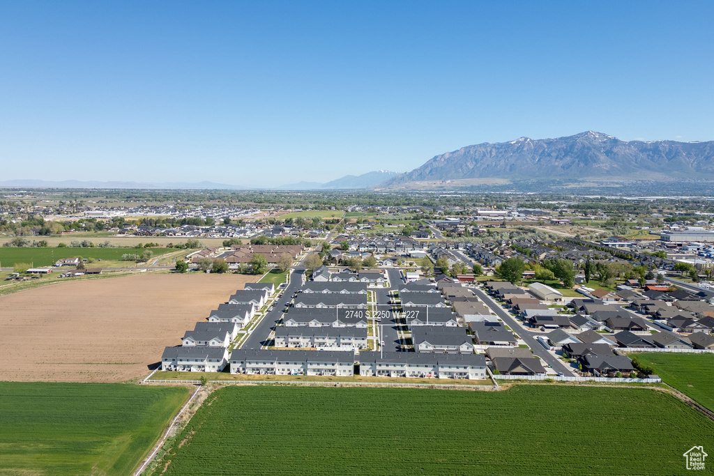 Aerial perspective of suburban area with a mountain backdrop