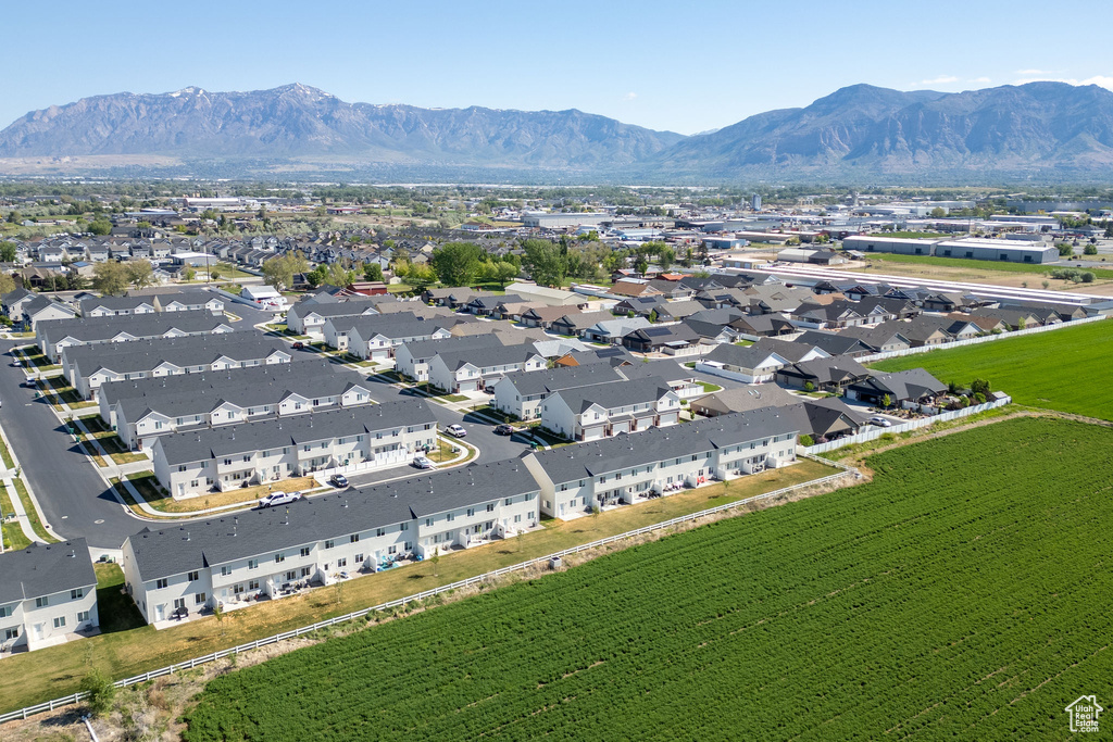 Aerial perspective of suburban area featuring a mountain backdrop