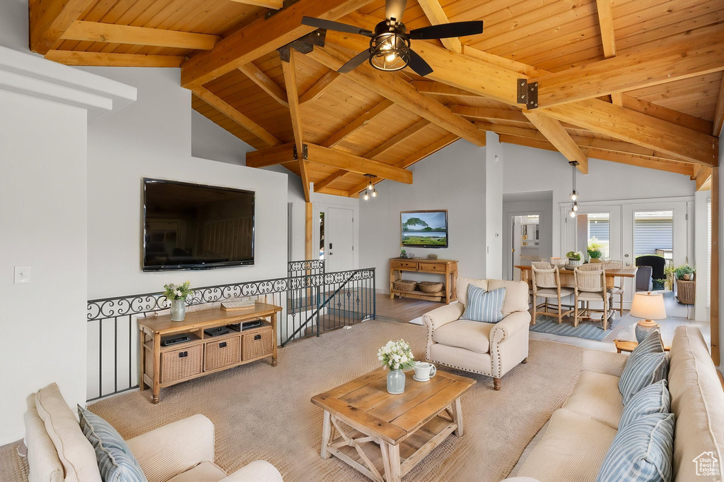 Carpeted living area with wood ceiling and ceiling fan