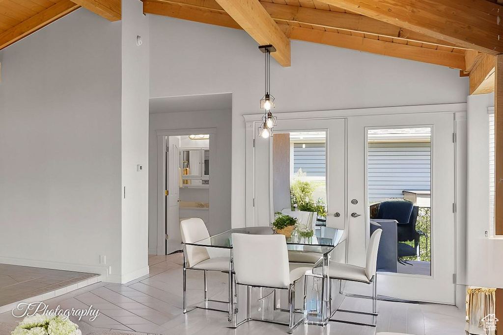 Dining room featuring french doors, wood ceiling, and light tile patterned floors