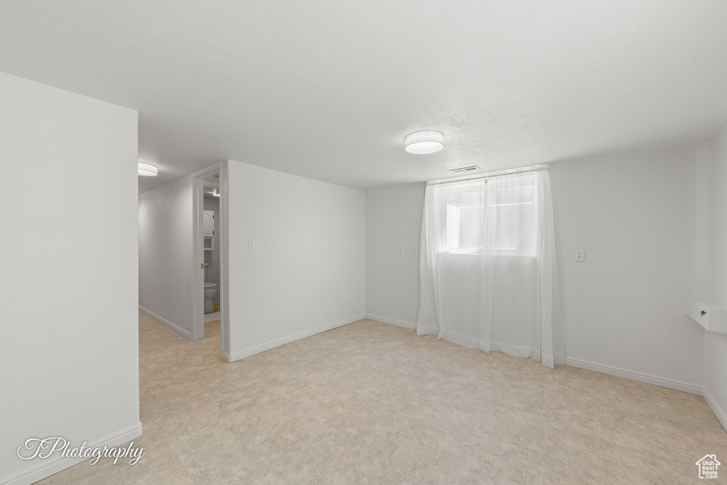 Below grade area with baseboards and carpet floors