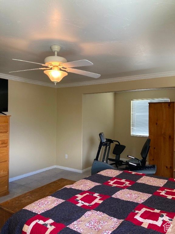 Bedroom with crown molding and a ceiling fan