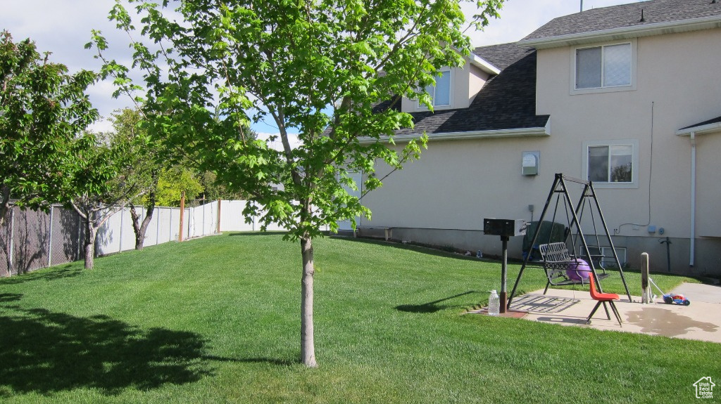 View of yard with a patio