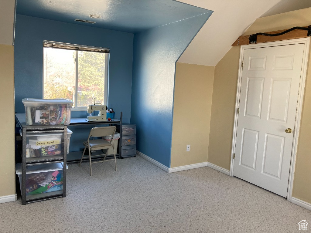 Carpeted office with baseboards