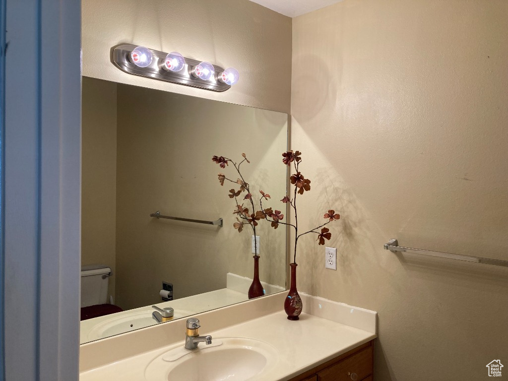 Bathroom featuring vanity and toilet