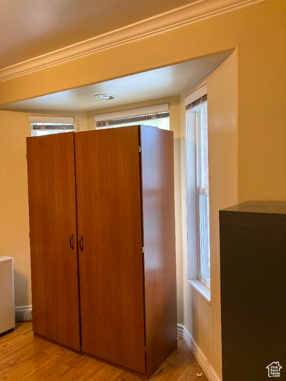 Detailed view of wood finished floors and baseboards