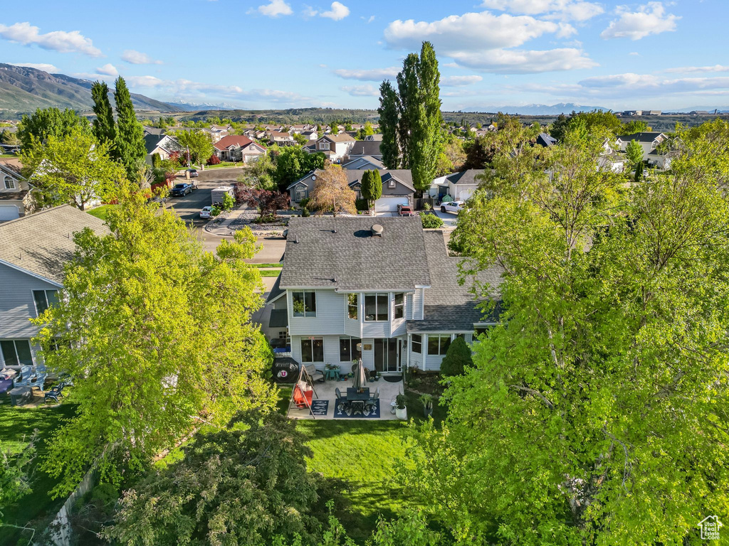 Aerial view of residential area featuring a mountain backdrop