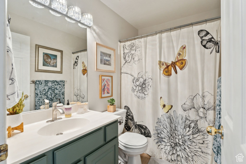 Full bath with toilet and vanity