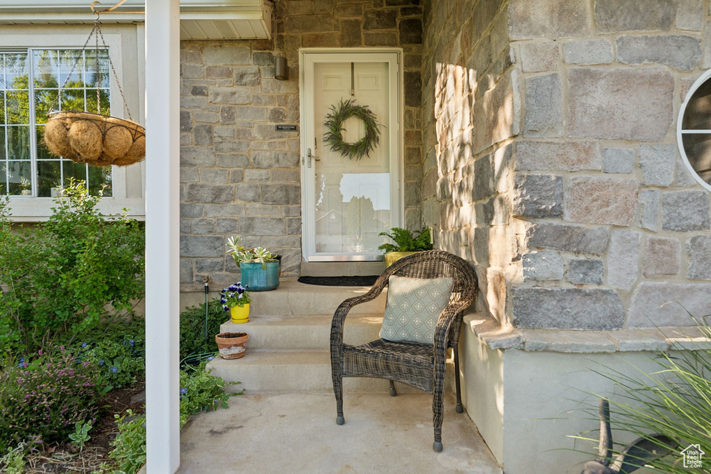 Doorway to property with stone siding