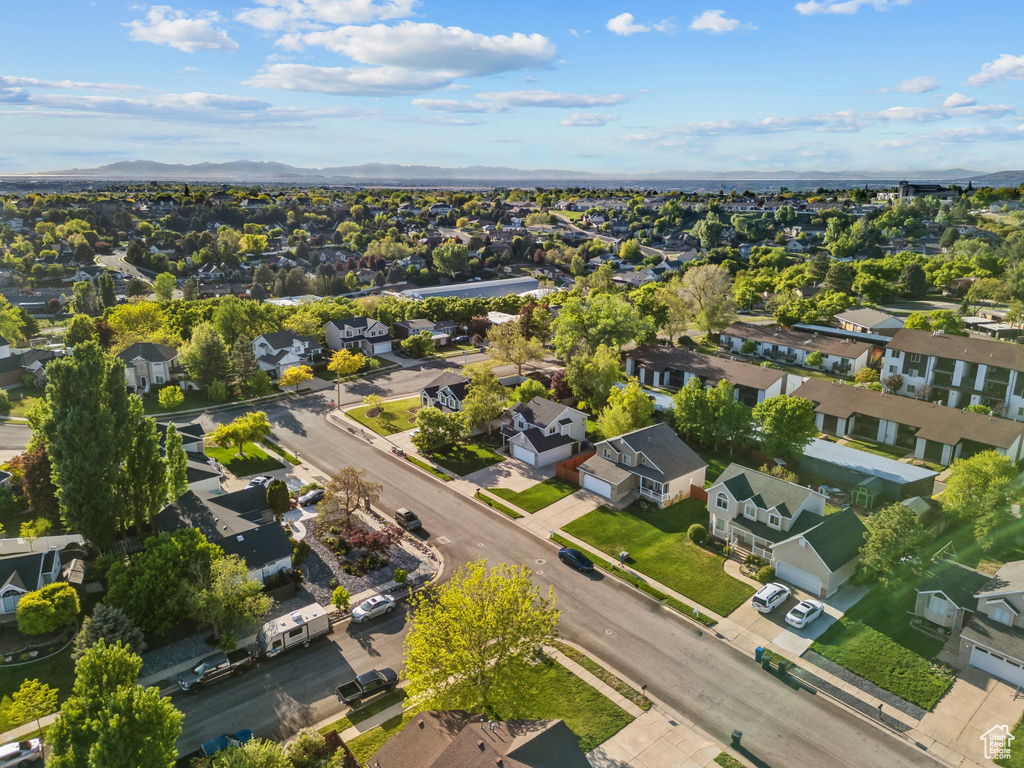 Aerial perspective of suburban area featuring a mountain backdrop