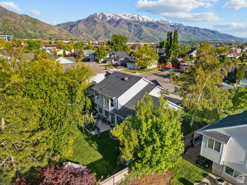Aerial perspective of suburban area with a mountain backdrop