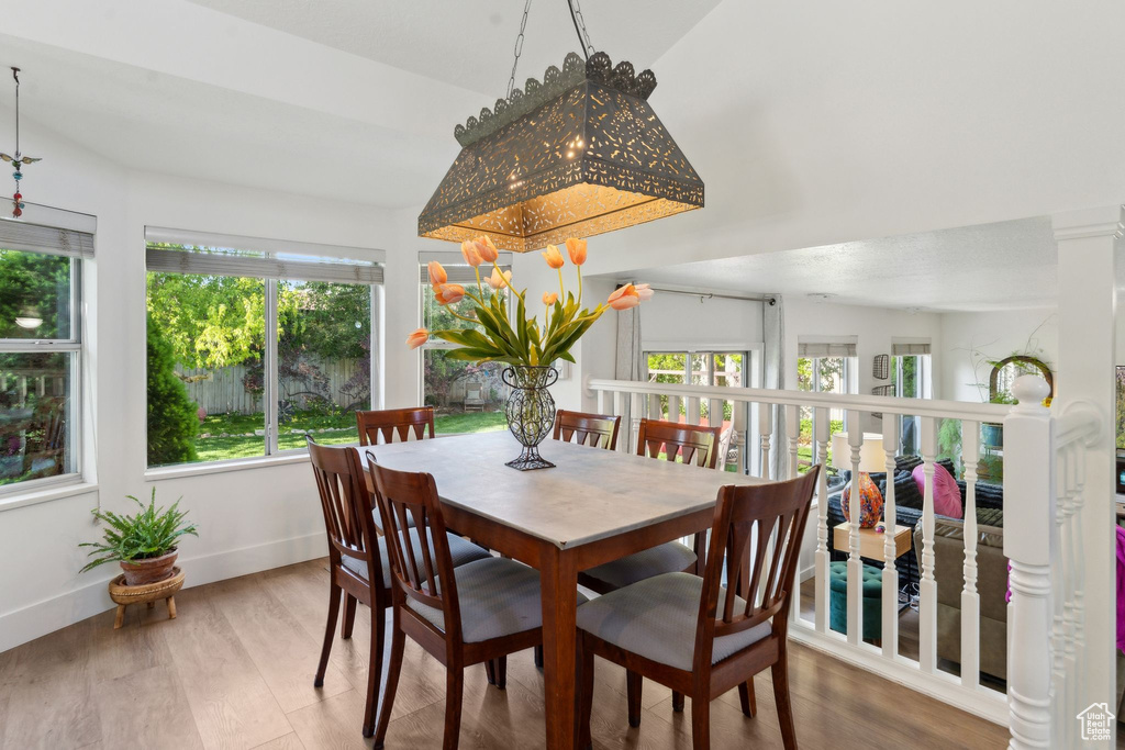 Dining room with wood finished floors and baseboards