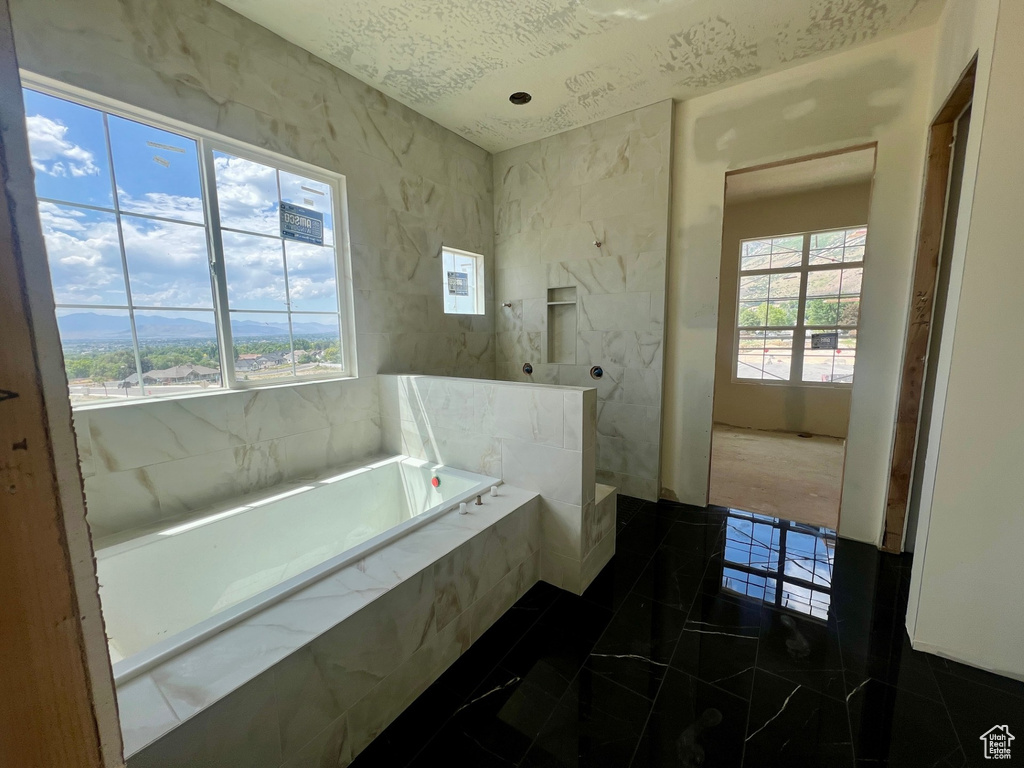 Bathroom with a garden tub and a walk in shower