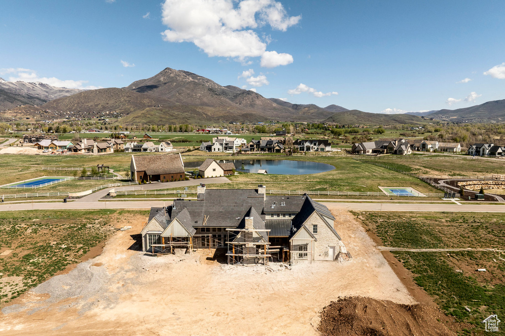 View of mountain background with a nearby body of water and nearby suburban area