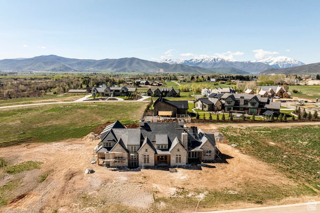 Aerial perspective of suburban area with a mountain backdrop
