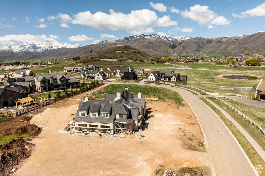 Aerial perspective of suburban area featuring a mountainous background