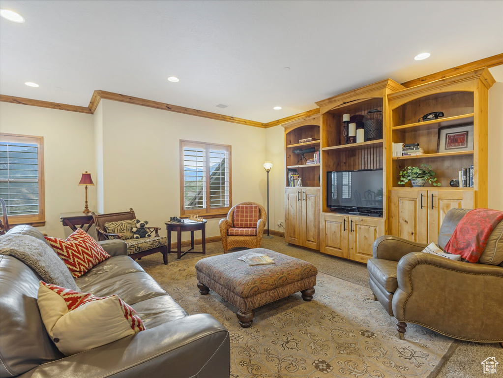 Living area featuring carpet floors, ornamental molding, recessed lighting, and baseboards