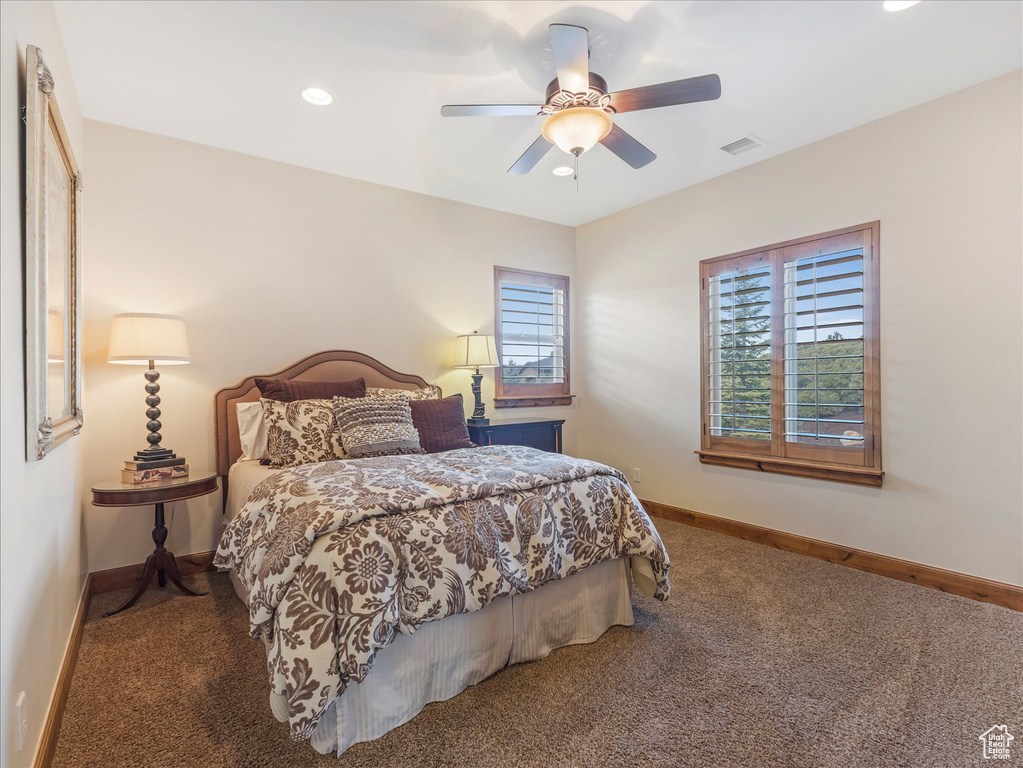 Bedroom with carpet flooring, baseboards, recessed lighting, and ceiling fan