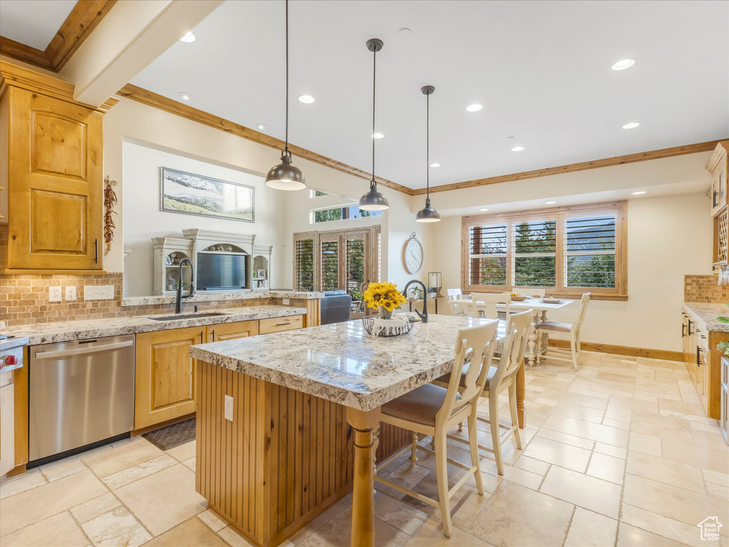 Kitchen with dishwasher, a sink, ornamental molding, backsplash, and recessed lighting