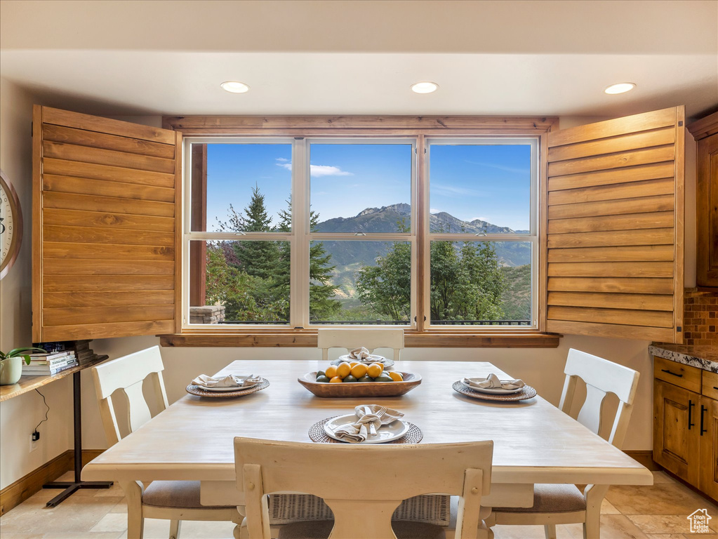 Dining area with recessed lighting and a mountain view