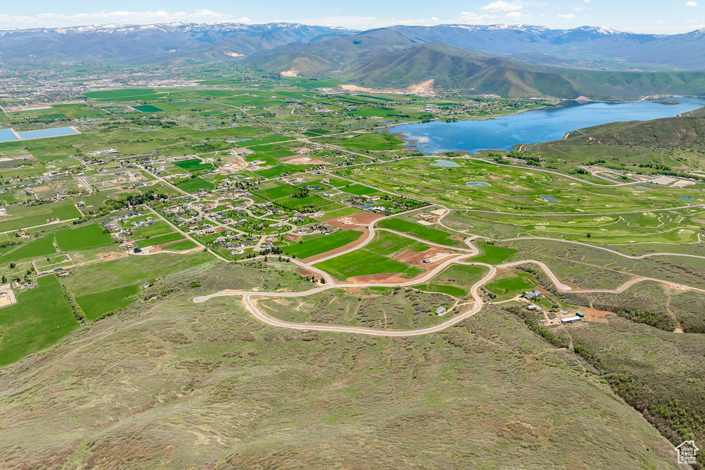 View of property location featuring a water and mountain view