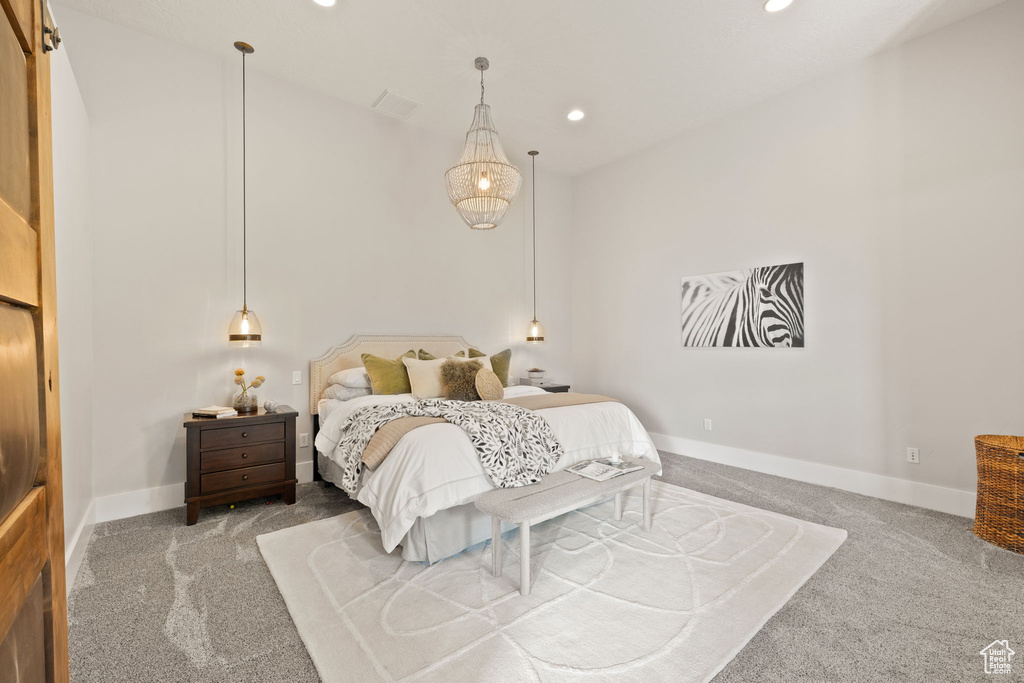 Carpeted bedroom featuring recessed lighting and baseboards