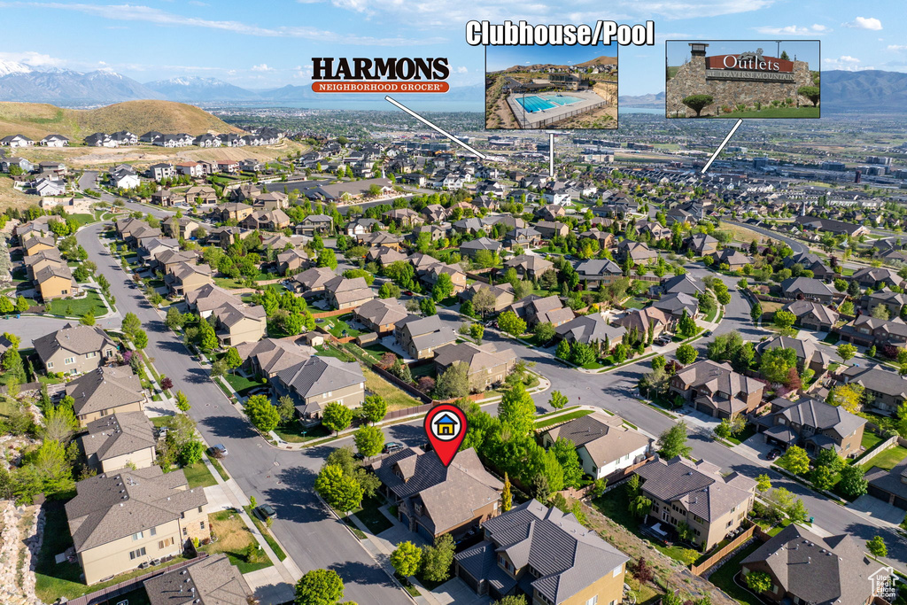 Aerial perspective of suburban area featuring a mountainous background