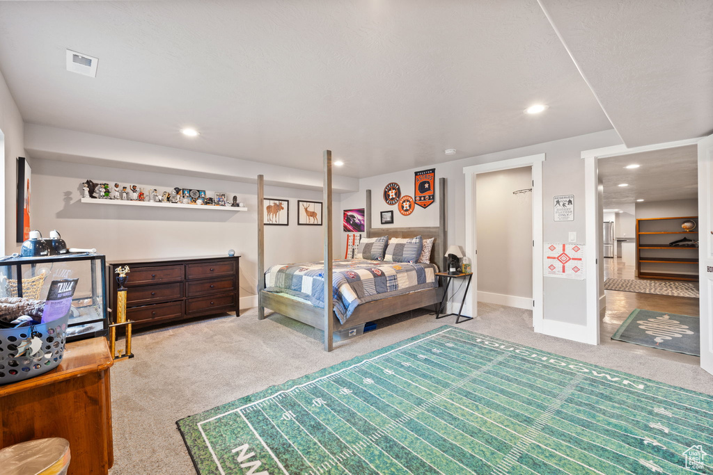 Bedroom featuring carpet, recessed lighting, and baseboards