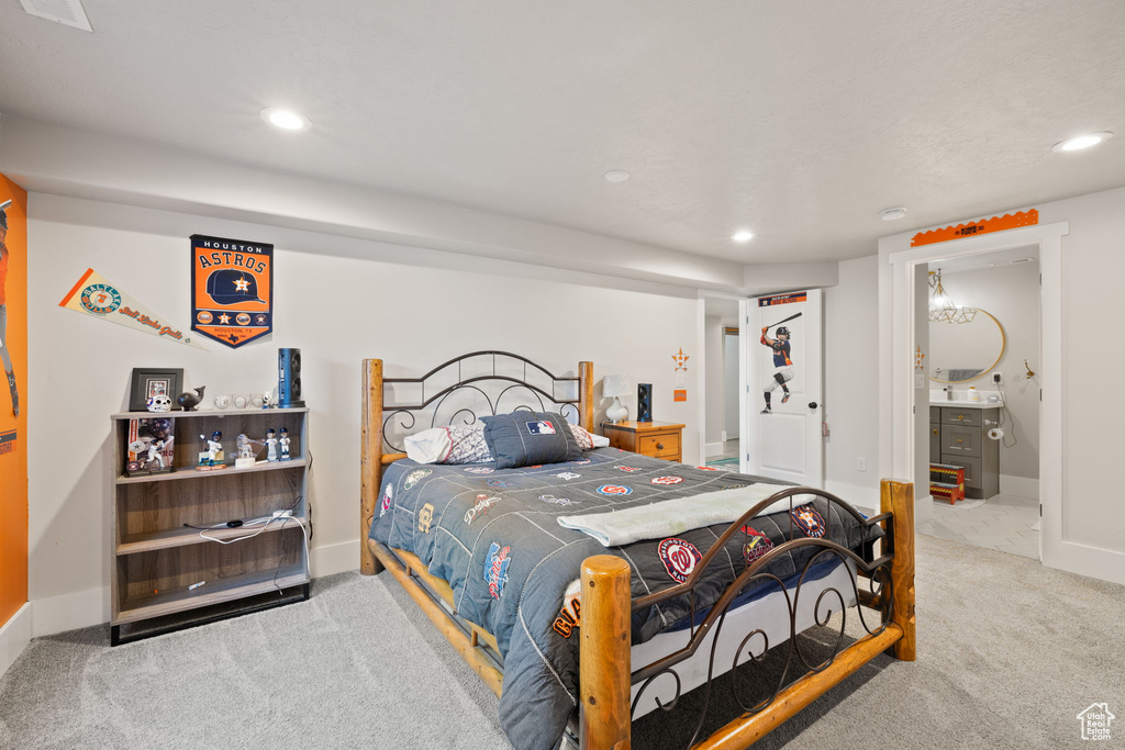 Carpeted bedroom featuring recessed lighting and baseboards