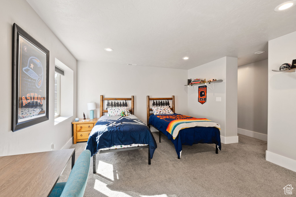 Bedroom with carpet floors, recessed lighting, and baseboards