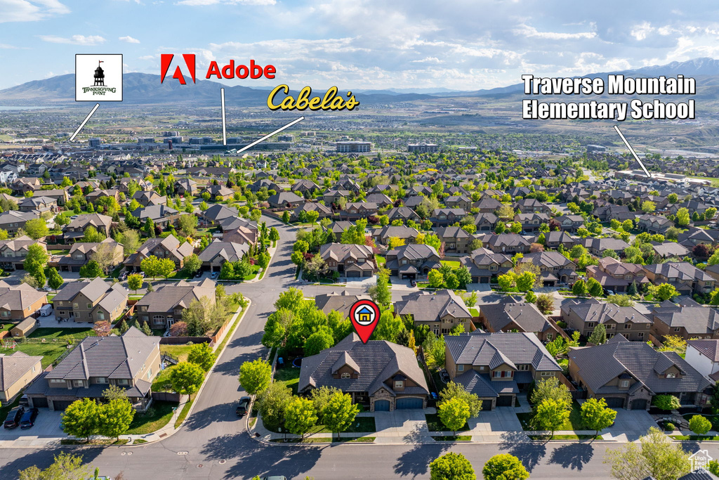 Aerial perspective of suburban area featuring a mountainous background