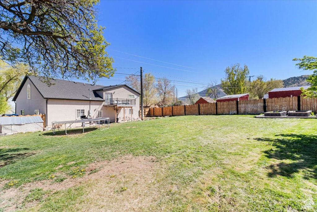 View of yard with a trampoline