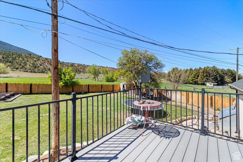 Wooden deck featuring a mountain view