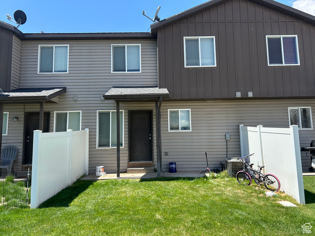 Back of house featuring board and batten siding and entry steps