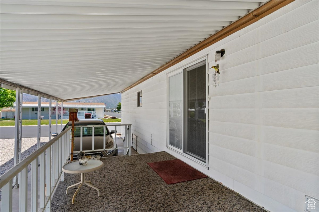 View of patio featuring a carport